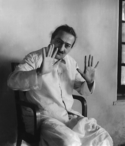 Baba communicating with hand gestures